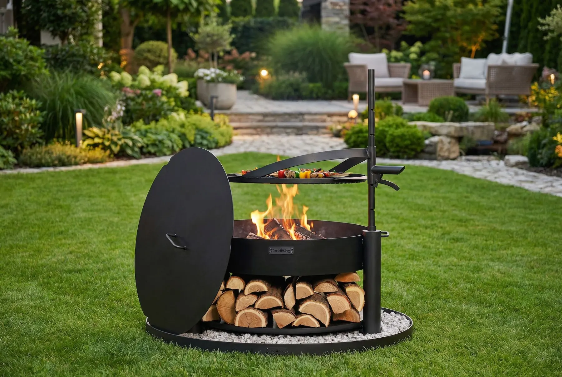 Fire bowlwith a lid and grill grate in a garden